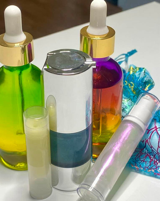 Seven Seas & Seven Stars™ skincare lineup with colorful dropper bottles, a blue airless pump, and treatment tubes