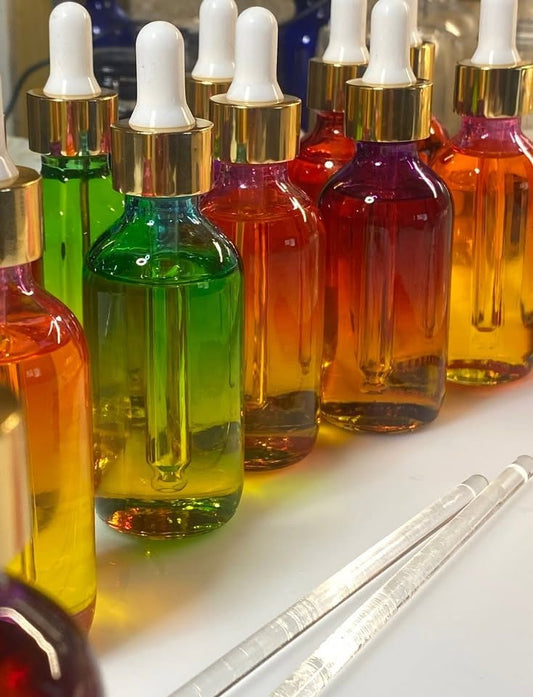 Rainbow dropper bottles of Celestial Pure Glow Oil Serum